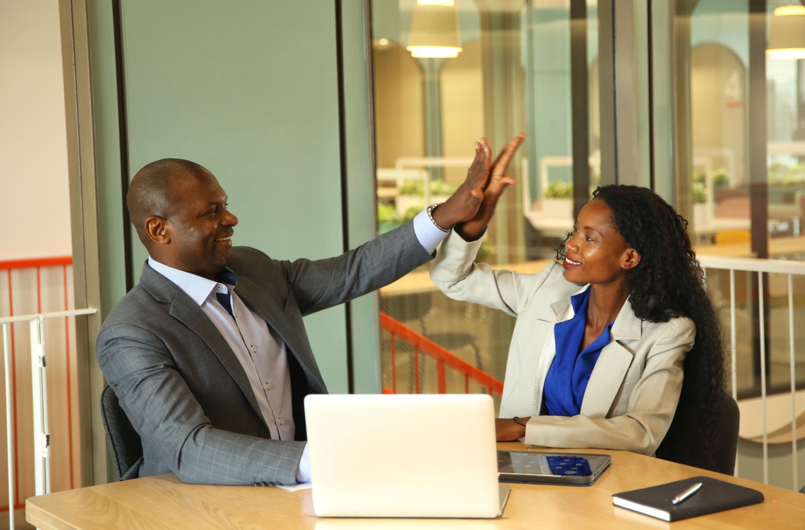 Finance coach discussing a plan with clients